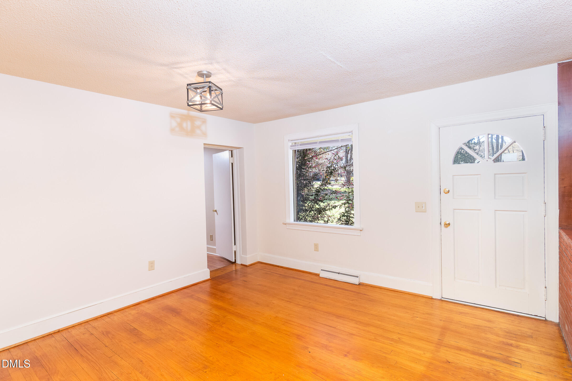 704 Pearces Road Zebulon, NC 27597 - Photo 8 of 26 a view of an empty room
