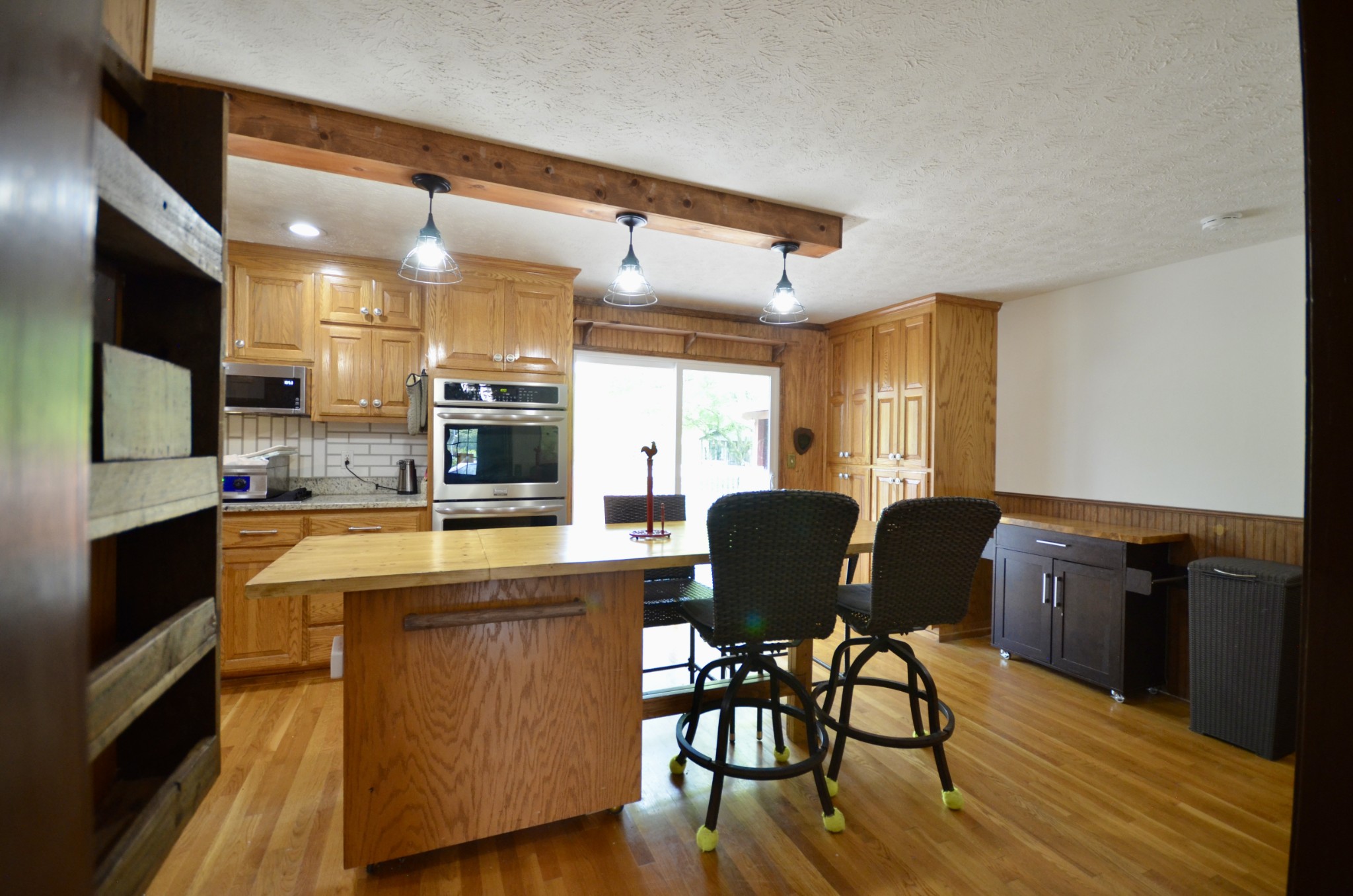 1355 Westfield Road Dickson, TN 37055 - Photo 34 of 83 a living room with stainless steel appliances kitchen island granite countertop furniture a dining table and chairs with wooden floor