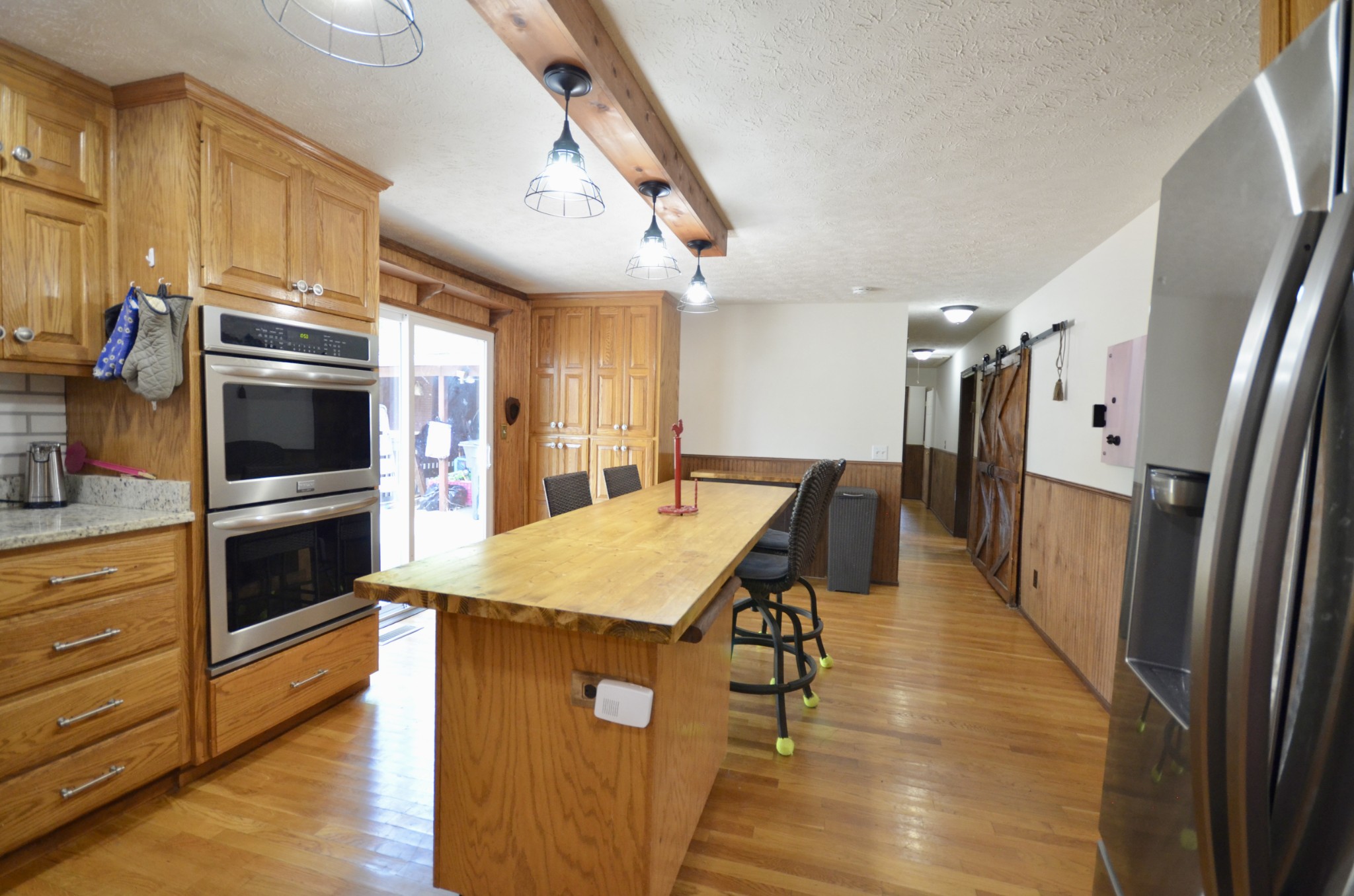 1355 Westfield Road Dickson, TN 37055 - Photo 36 of 83 a kitchen with stainless steel appliances kitchen island granite countertop a refrigerator a stove and a sink with cabinets