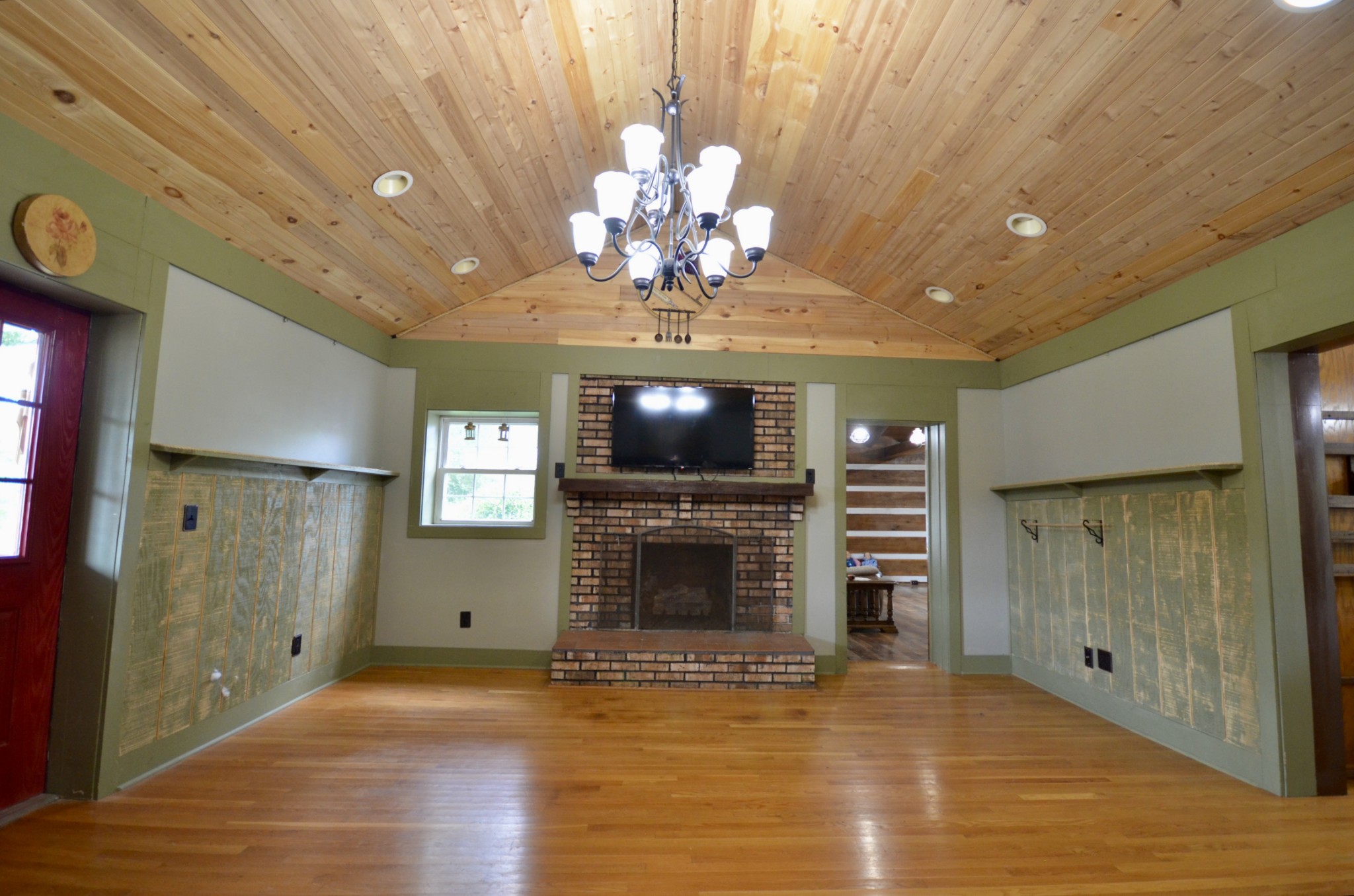 1355 Westfield Road Dickson, TN 37055 - Photo 41 of 83 a view of a livingroom with a fireplace a chandelier and wooden floor