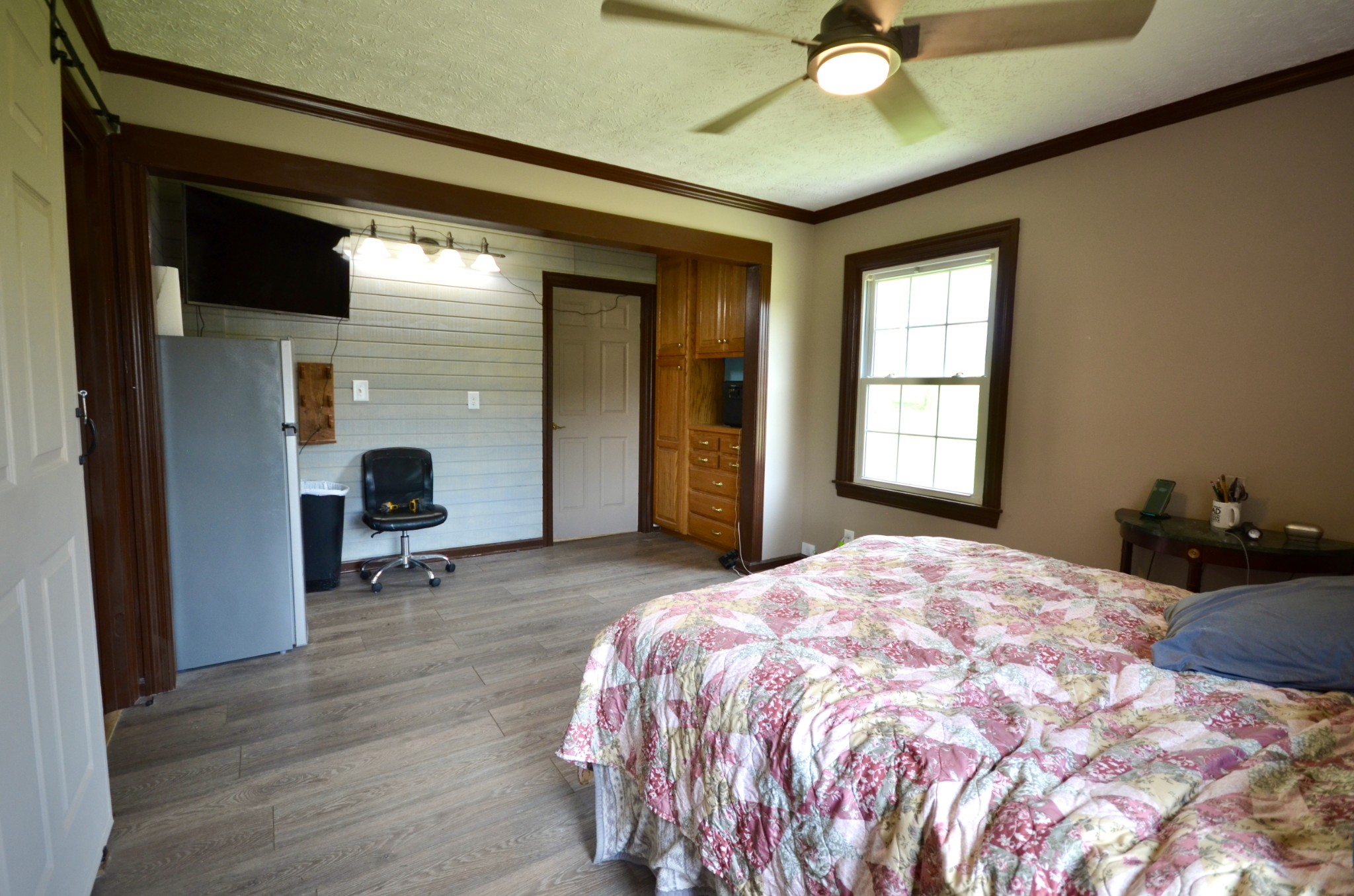 1355 Westfield Road Dickson, TN 37055 - Photo 47 of 83 a bedroom with a bed and a chandelier