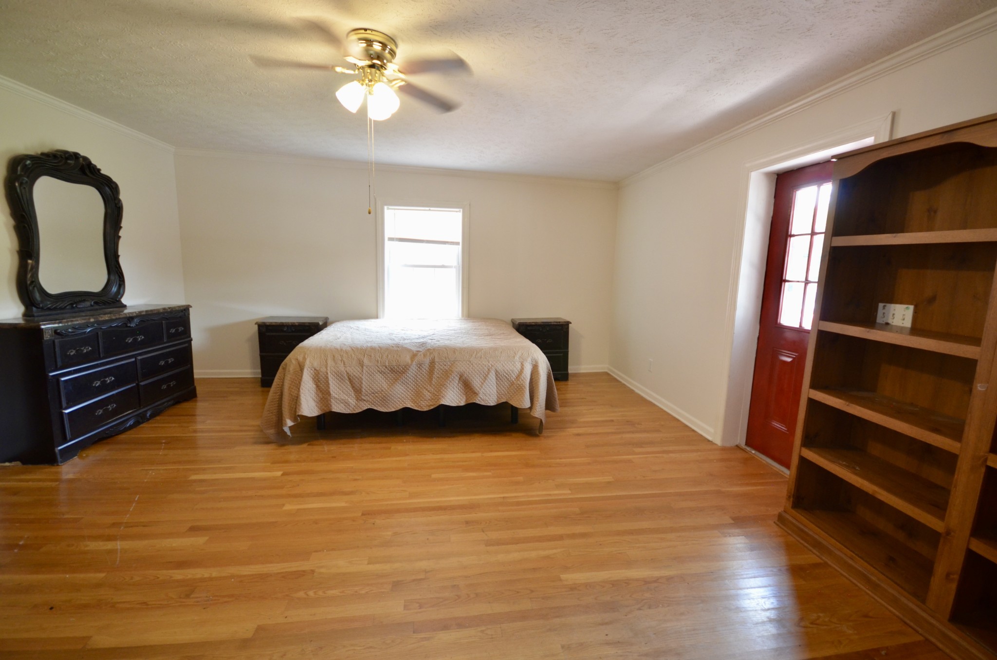 1355 Westfield Road Dickson, TN 37055 - Photo 58 of 83 a bedroom with a bed and a chandelier