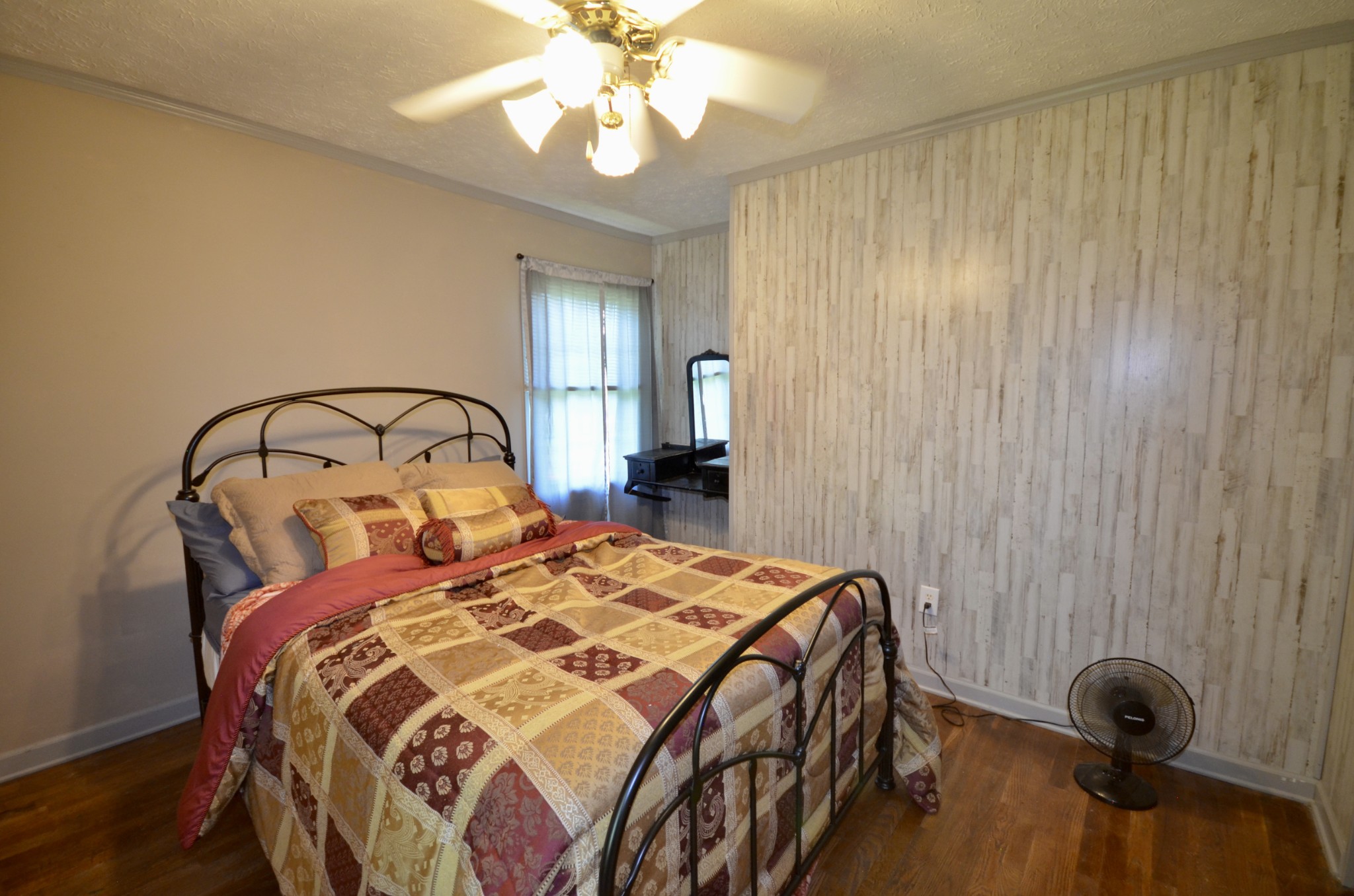 1355 Westfield Road Dickson, TN 37055 - Photo 62 of 83 a bedroom with a bed and a chandelier