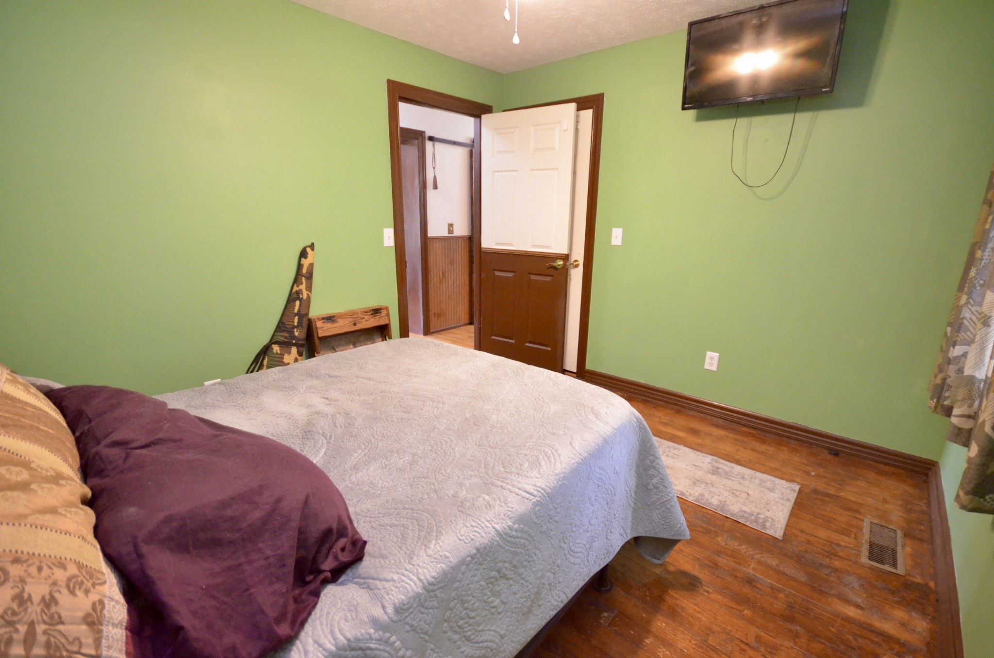1355 Westfield Road Dickson, TN 37055 - Photo 64 of 83 a bedroom with a bed and a flat screen tv