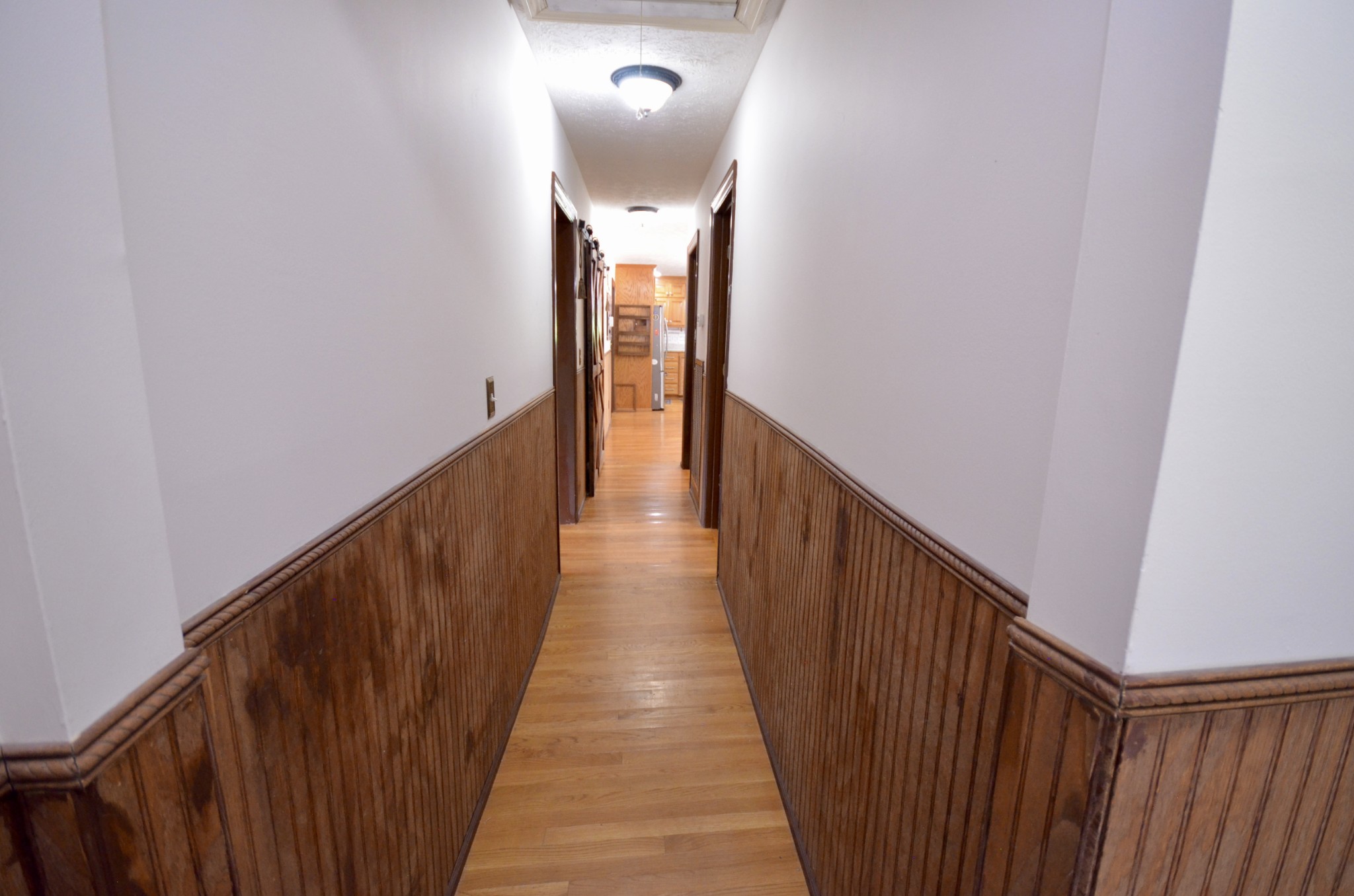 1355 Westfield Road Dickson, TN 37055 - Photo 65 of 83 a view of a hallway with wooden floor