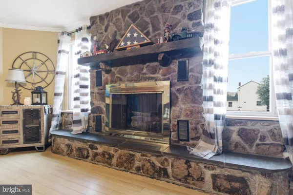 a living room with fireplace furniture and a fireplace
