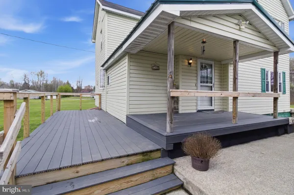 a view of a wooden deck with a bench