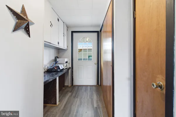 a view of a kitchen from the hallway