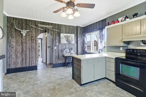 a kitchen that has a cabinets and a stove