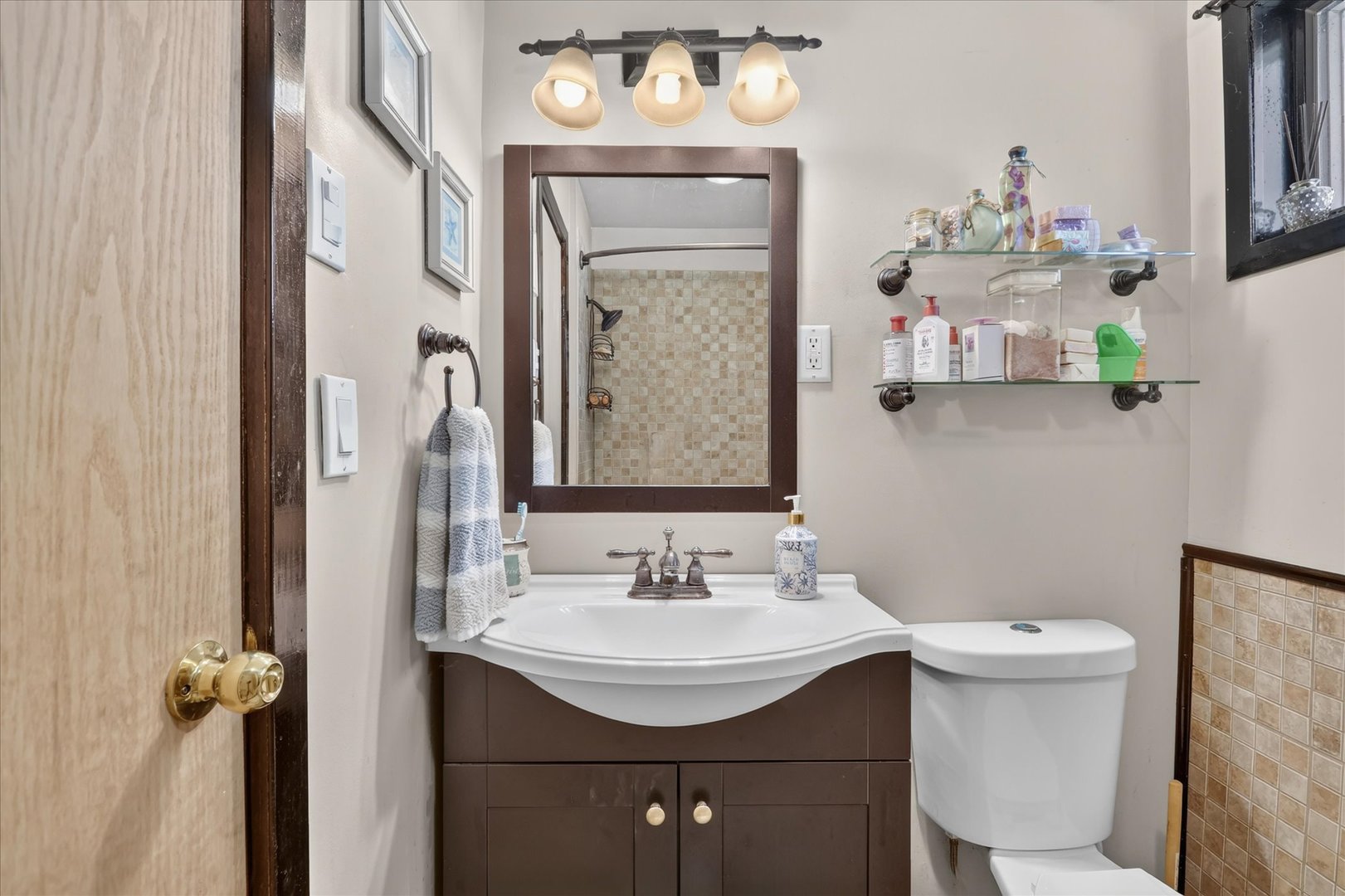 1204 West Violet Street Freeport, IL 61032 - Photo 27 of 36 a bathroom with a sink double vanity and a mirror