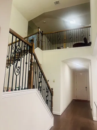 a view of staircase with lots of wooden floor