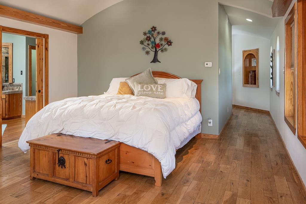 290 Japonica Road Hunt, TX 78024 - Photo 27 of 78 a bedroom with a bed and wooden floor