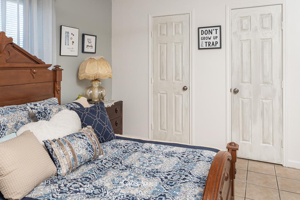 290 Japonica Road Hunt, TX 78024 - Photo 63 of 78 a bed room with a bed and a painting