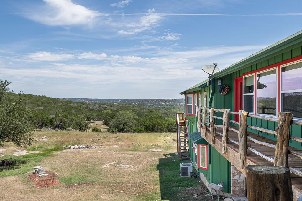 290 Japonica Road Hunt, TX 78024 - Photo 72 of 78 a view of a house with many windows next to a road