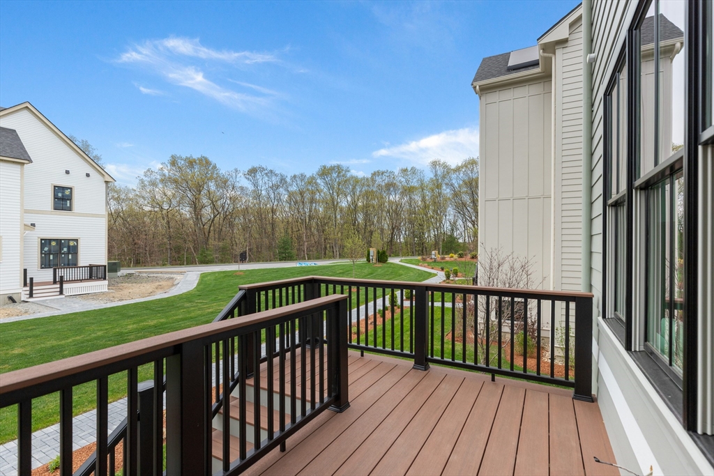 20 Common Court, Unit 20 Lexington, MA 02421 - Photo 25 of 27 a view of backyard with deck and hardwood
