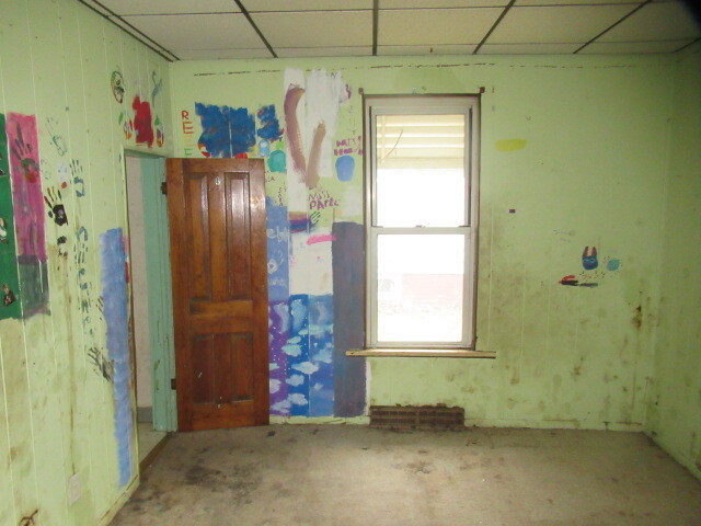 33 State Street Danville, IL 61832 - Photo 9 of 17 a bathroom with a window and a shower
