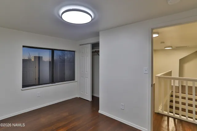 wooden floor in an empty room and a window