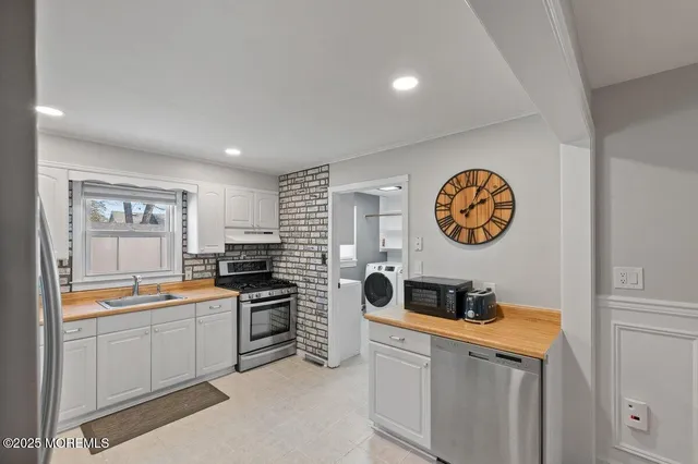 a view of a kitchen with a sink cabinets and a window