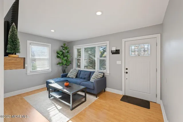 a living room with furniture and windows