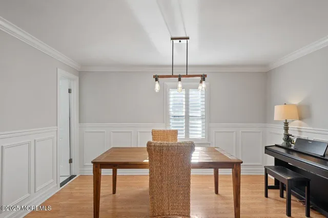 a view of a livingroom with furniture window and wooden floor