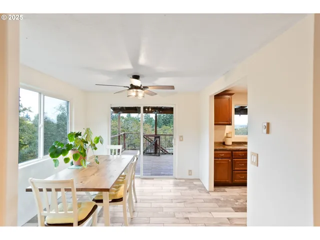 a view of a dining room with furniture window and outside view