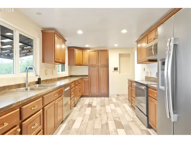 a kitchen with a sink stove and microwave