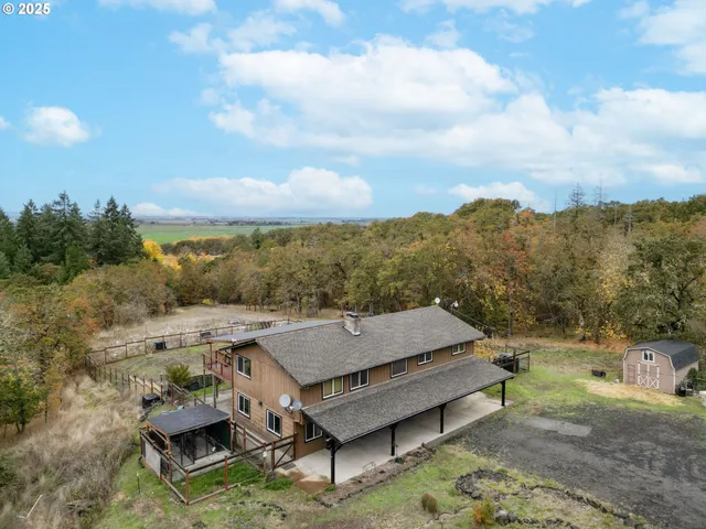 a backyard of a house with large trees