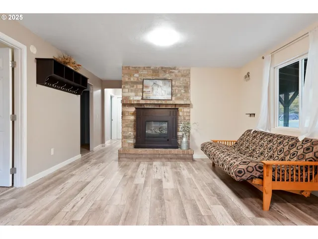 a bedroom with furniture and a fireplace