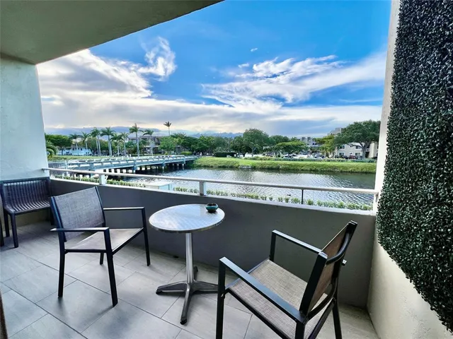 a view of a chairs and table in the terrace