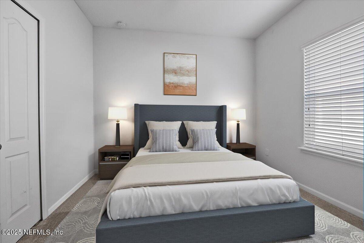 102 Anguilla Boulevard St. Augustine, FL 32092 - Photo 14 of 25 a large bed sitting in a bedroom next to a window