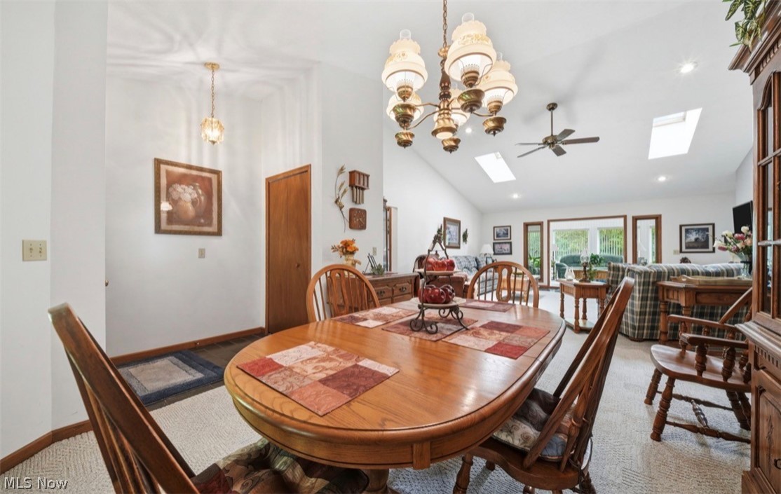 3556 Lake Road Conneaut, OH 44030 - Photo 15 of 39 Open-concept living space featuring vaulted ceilings, recessed lighting, and two skylights