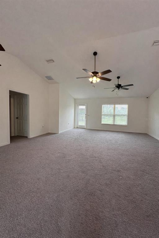 6800 Northeast 175th Street Road Citra, FL 32113 - Photo 9 of 27 a view of a livingroom with a ceiling fan and window