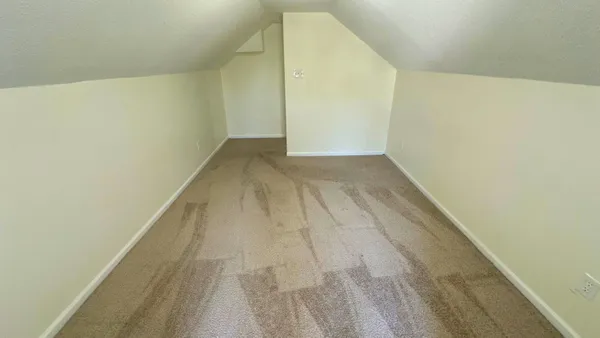 a view of a big room with wooden floor