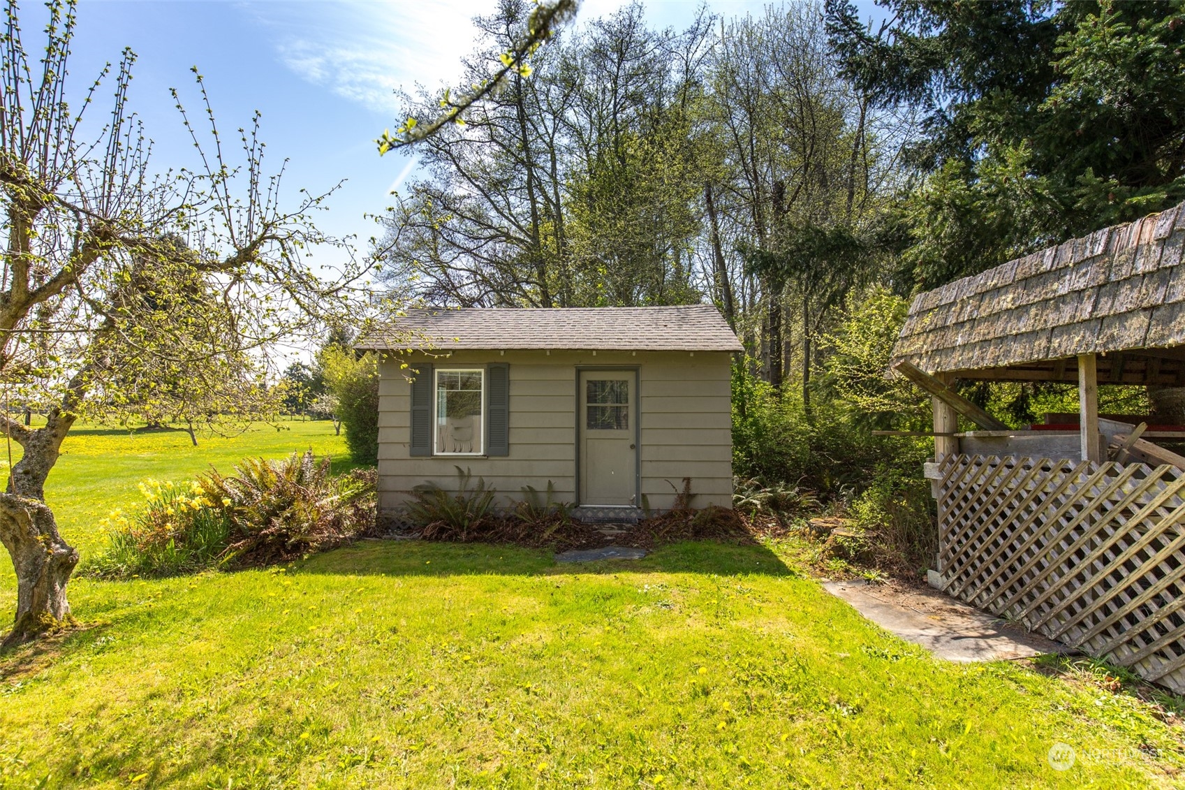 83 Mariners Point Road Sequim, WA 98382 - Photo 8 of 40 a view of a house with a yard