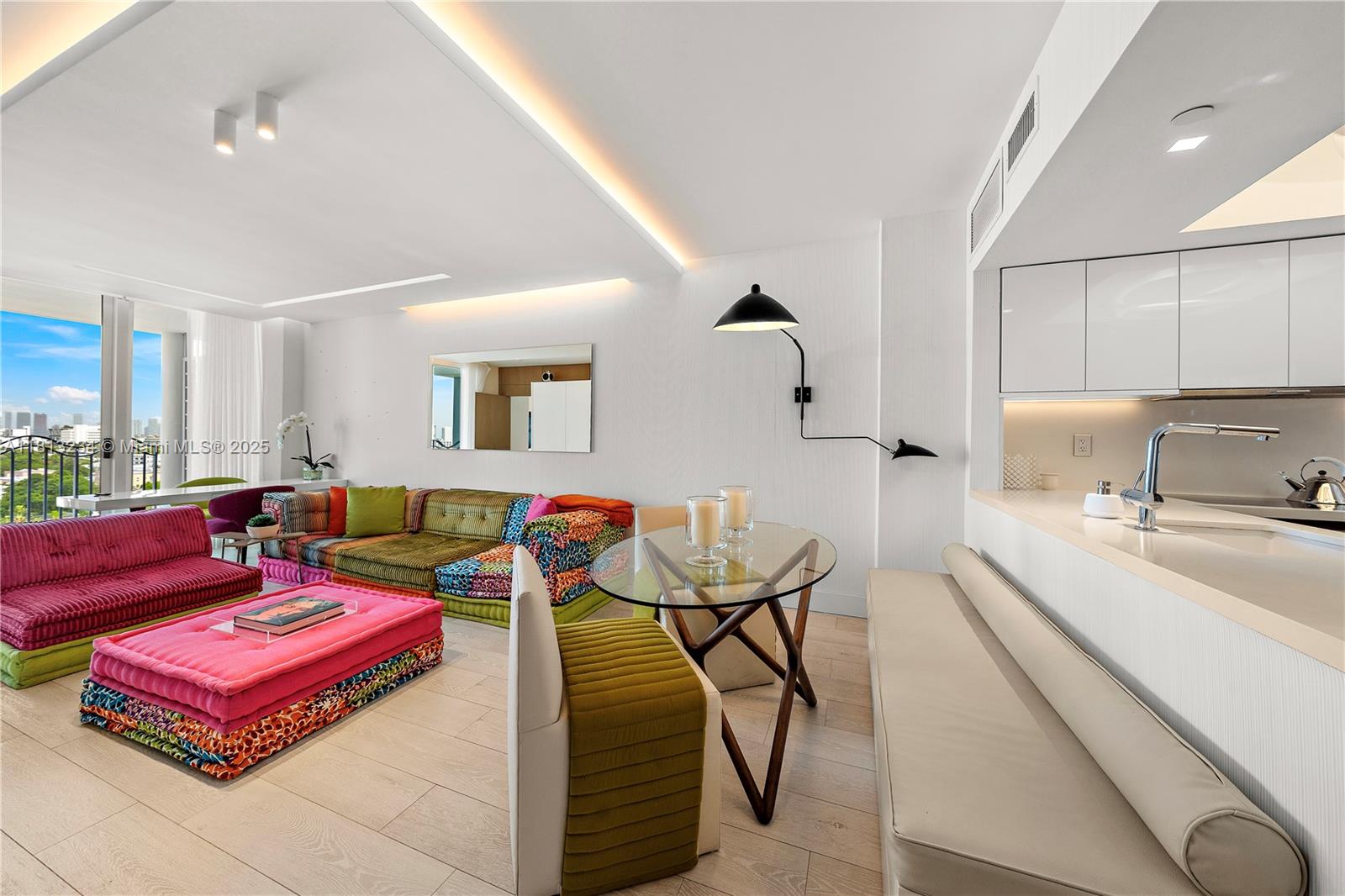 1500 Ocean Drive, Unit 910 Miami Beach, FL 33139 - Photo 12 of 40 a reading room with furniture and wooden floor