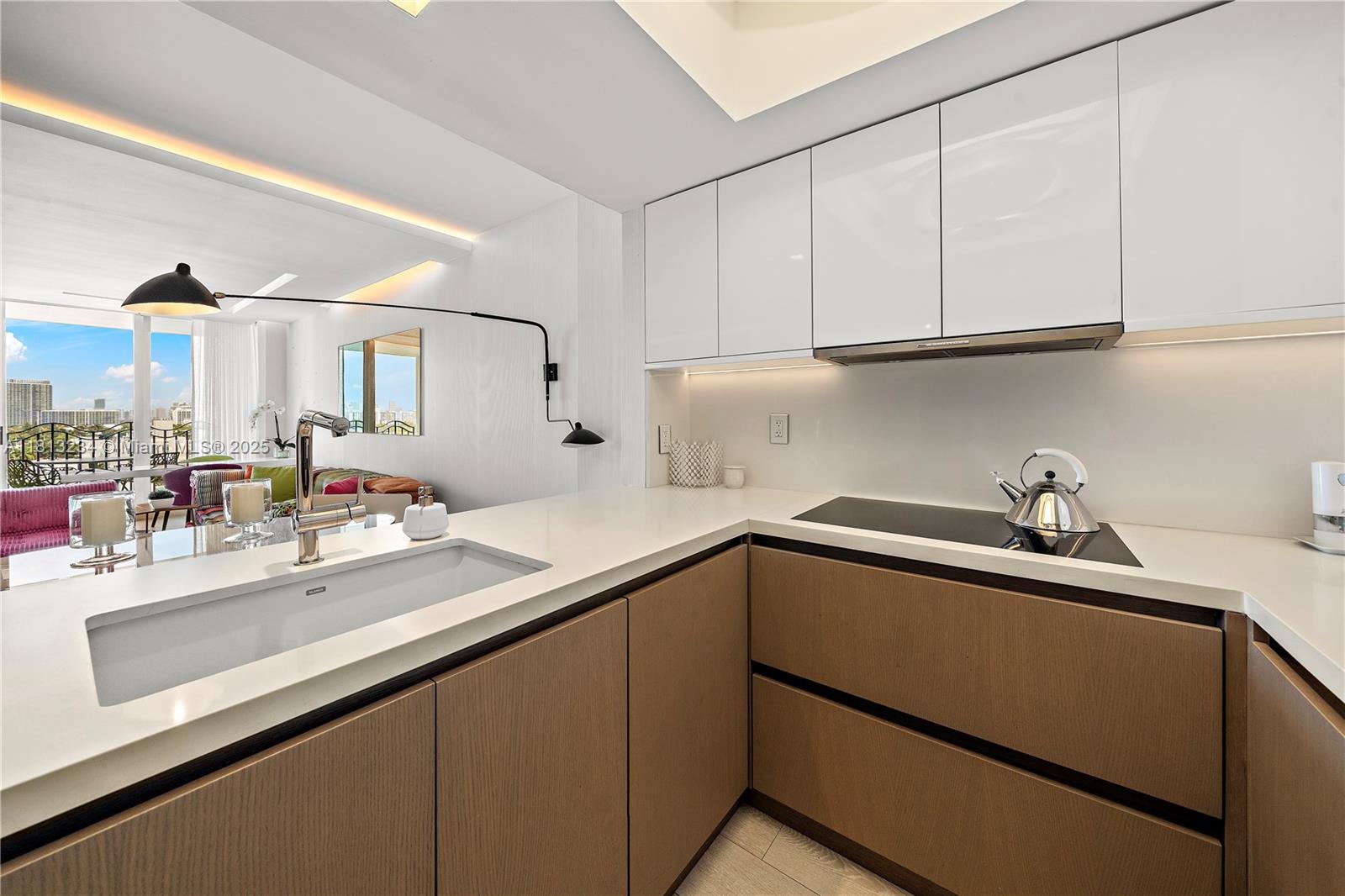 1500 Ocean Drive, Unit 910 Miami Beach, FL 33139 - Photo 20 of 40 a kitchen with a sink and cabinets