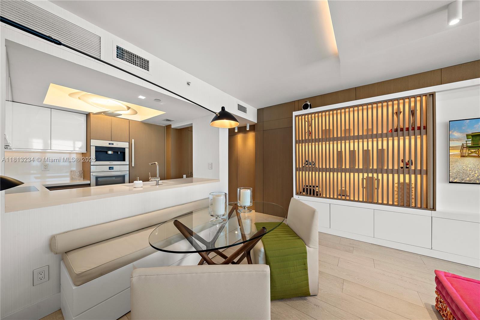 1500 Ocean Drive, Unit 910 Miami Beach, FL 33139 - Photo 21 of 40 a living room with a couch and a table