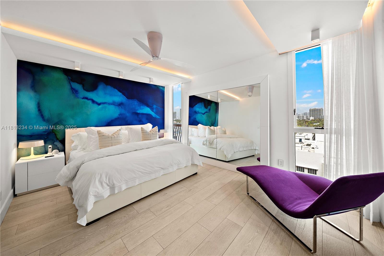 1500 Ocean Drive, Unit 910 Miami Beach, FL 33139 - Photo 30 of 40 a spacious bedroom with a bed and a chair
