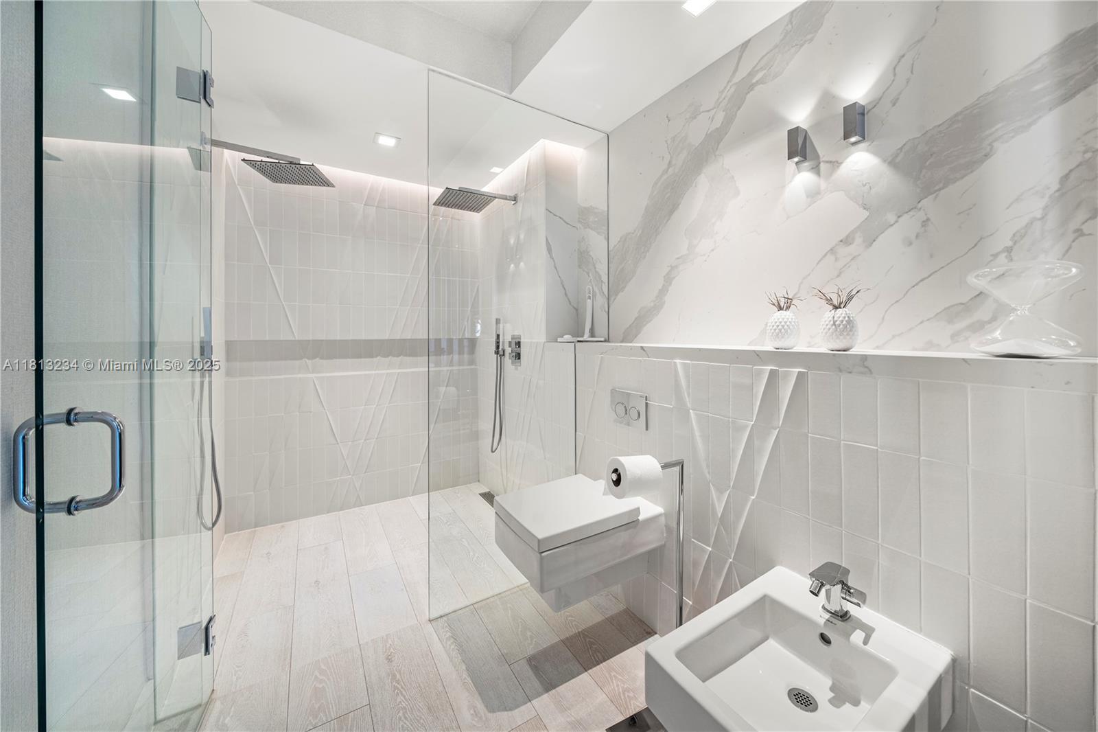 1500 Ocean Drive, Unit 910 Miami Beach, FL 33139 - Photo 35 of 40 a bathroom with a sink mirror and shower