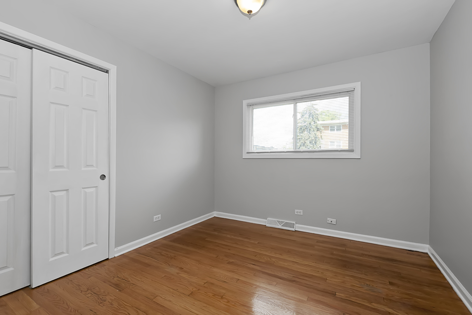 11700 South Harding Avenue Alsip, IL 60803 - Photo 11 of 17 wooden floor in an empty room with a window