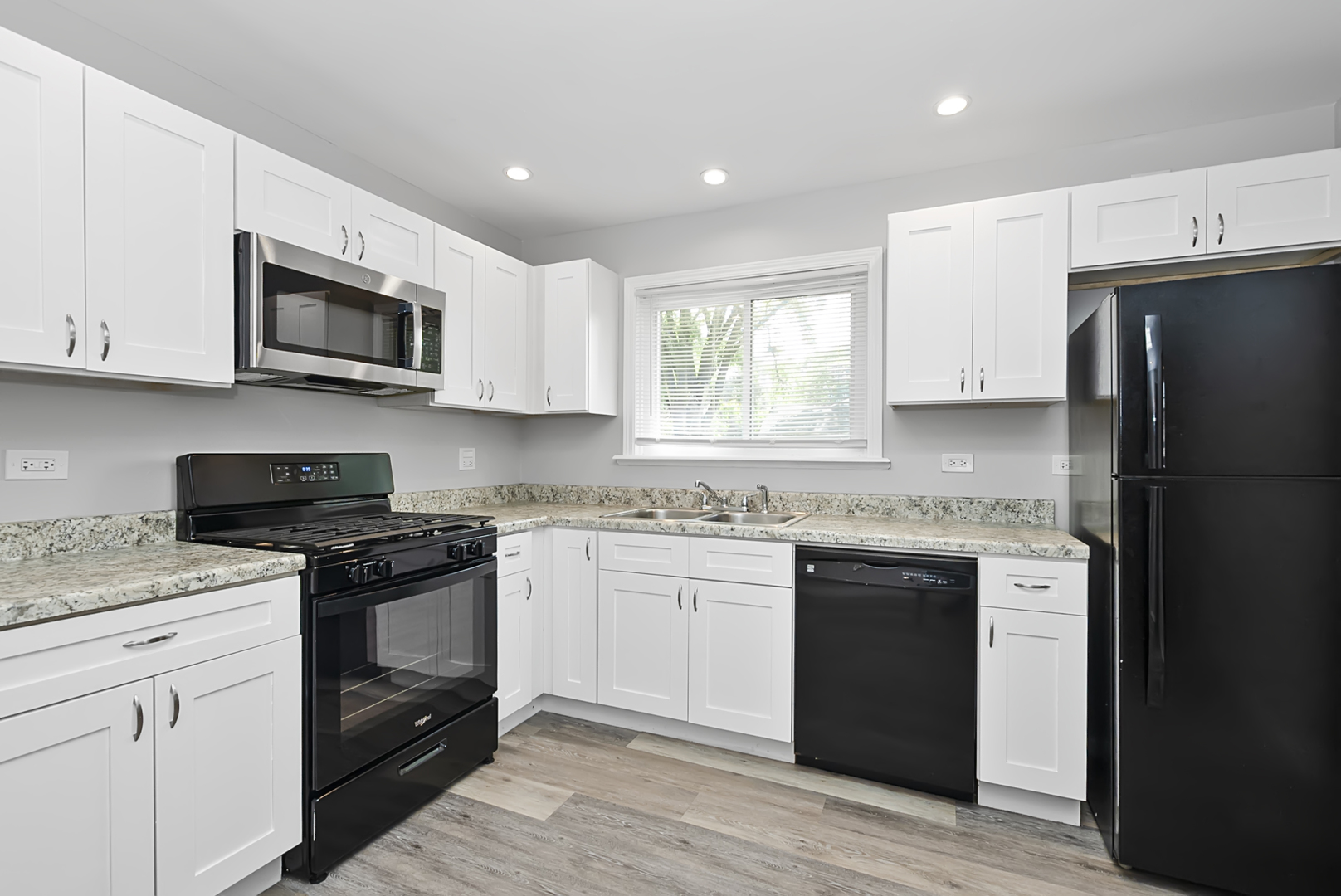 11700 South Harding Avenue Alsip, IL 60803 - Photo 13 of 17 a kitchen with stainless steel appliances granite countertop a stove top oven a refrigerator and white cabinets