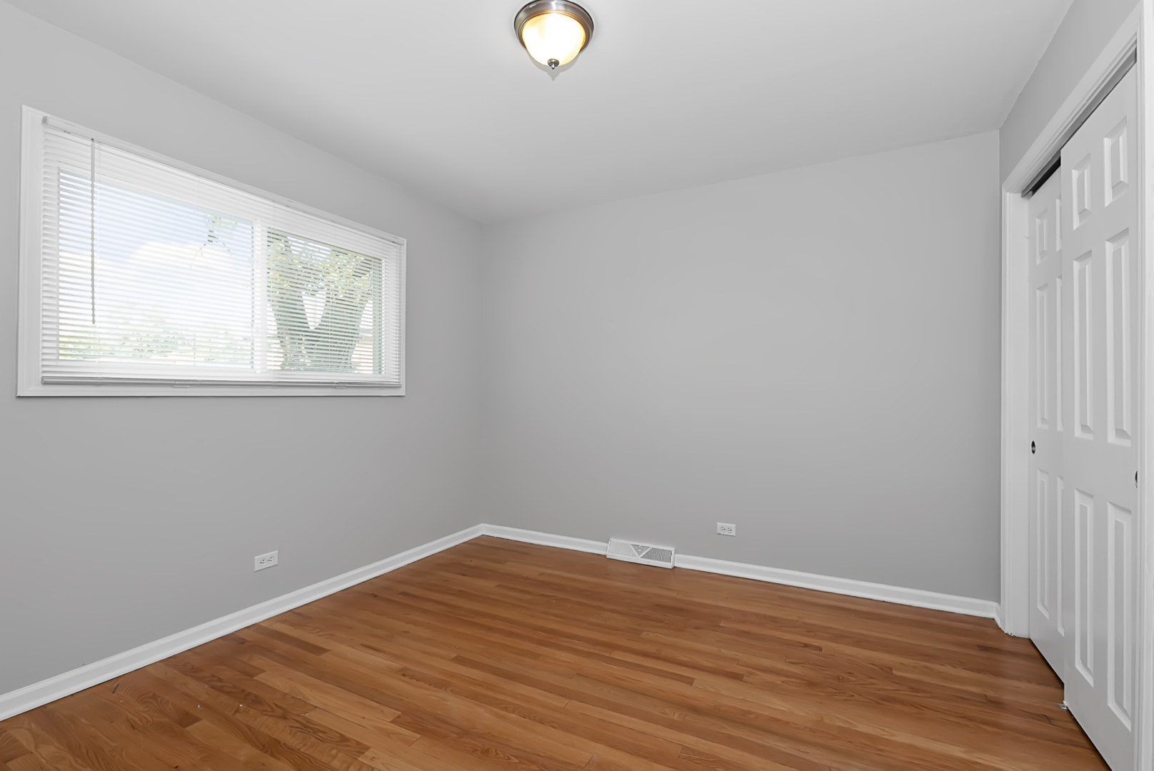 11700 South Harding Avenue Alsip, IL 60803 - Photo 14 of 17 wooden floor in an empty room with a window