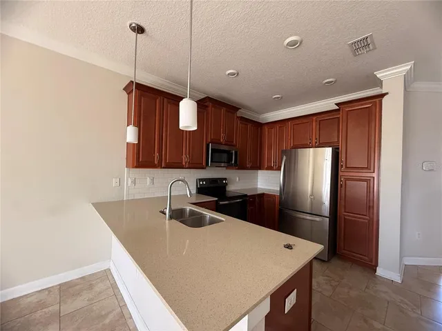 an empty room with a ceiling fan and window