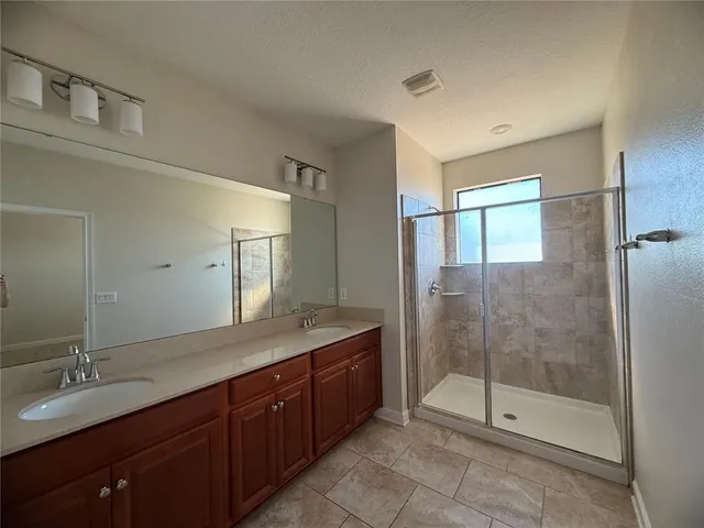 a view of a livingroom with a ceiling fan and window