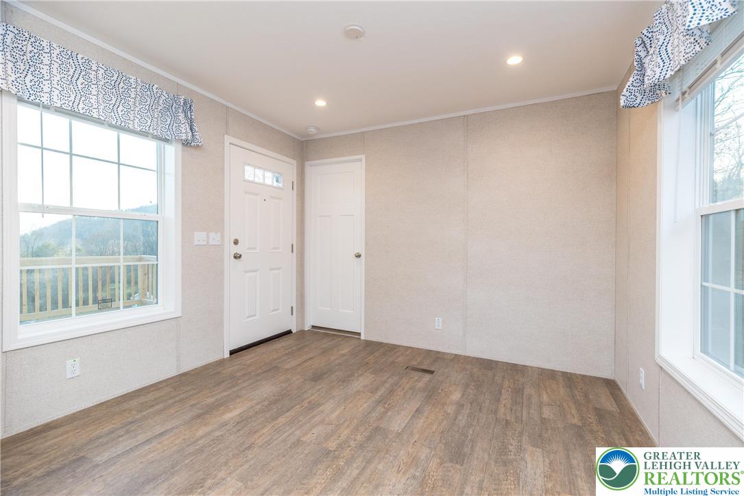 465 Royal Manor Road, Unit LOT 3 Easton, PA 18042 - Photo 9 of 13 an empty room with wooden floor and windows