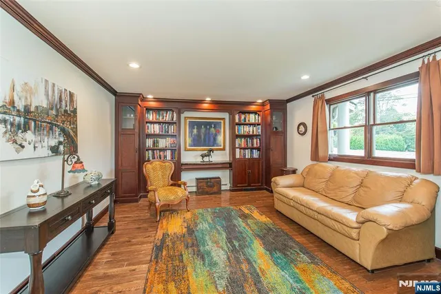 a living room with furniture and a rug