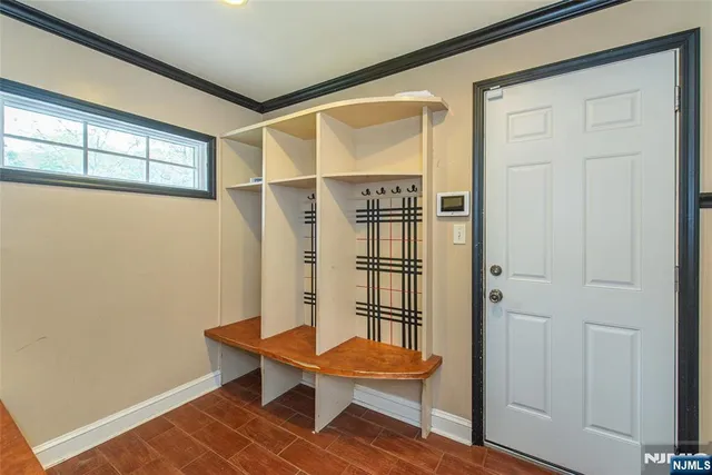 a room with wooden floor and a window