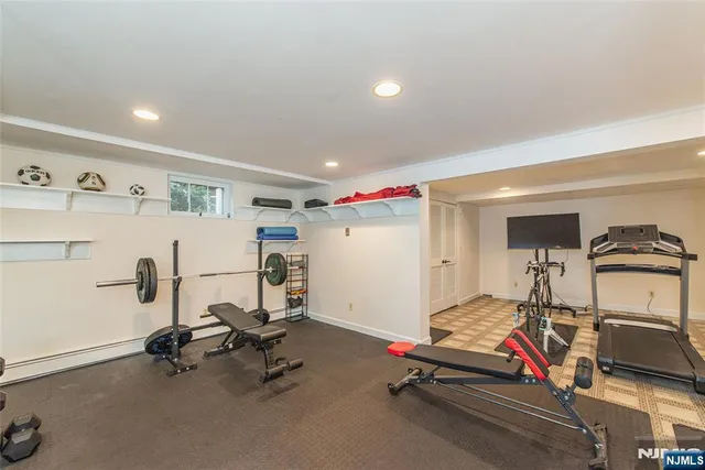 a patio with wooden floor and outdoor seating