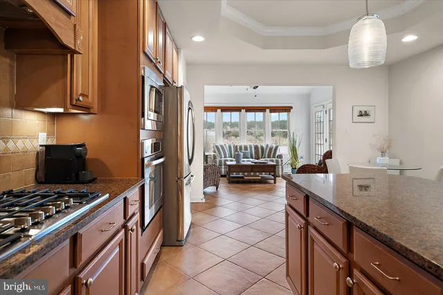 a view of a bedroom with furniture and a window