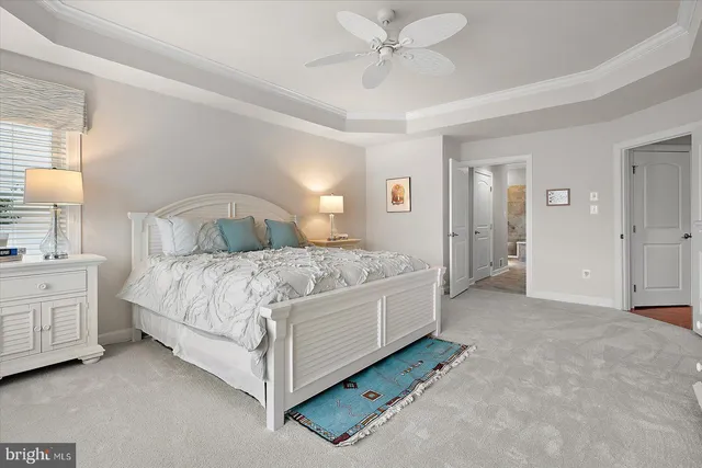 a view of a terrace with a table and chairs under an umbrella